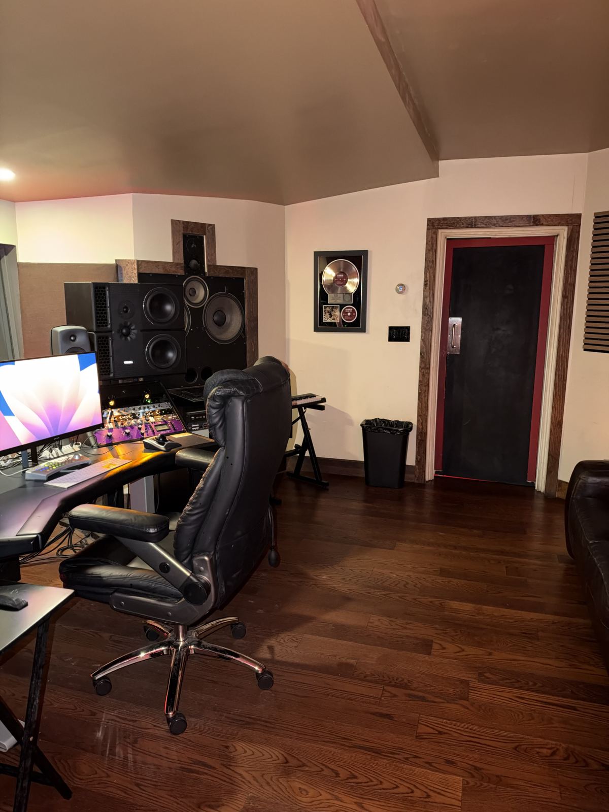 Room A — chair, monitors and booth door